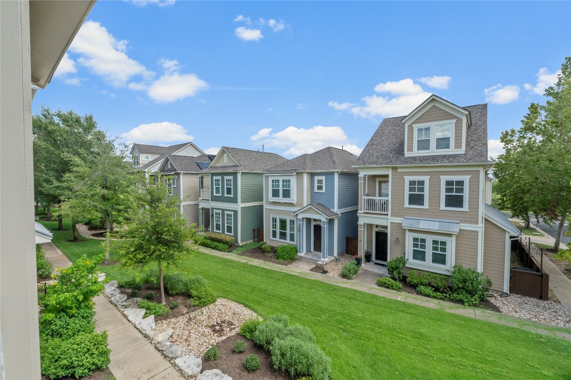 3900 Threadgill Street, Unit 16 Austin, TX 78723 - Photo 27 of 40 a front view of a house with a yard