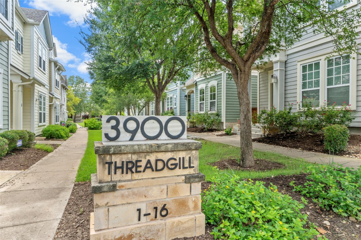 3900 Threadgill Street, Unit 16 Austin, TX 78723 - Photo 31 of 40 a sign on a pole on a street