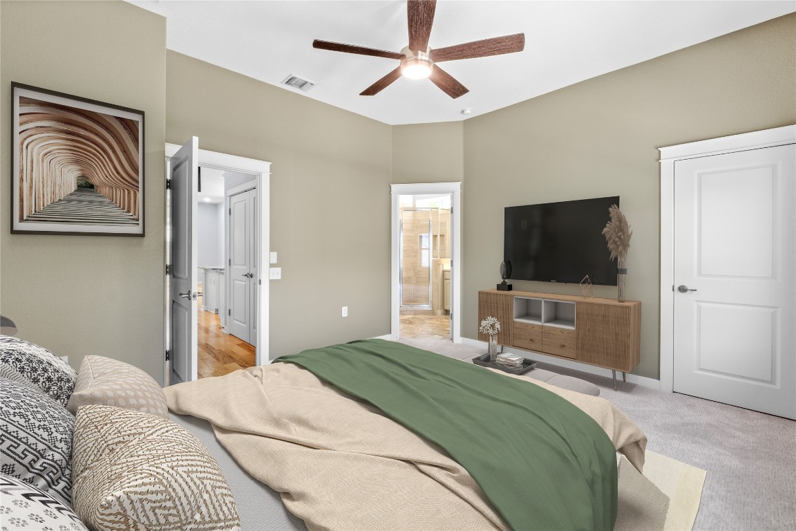 3900 Threadgill Street, Unit 16 Austin, TX 78723 - Photo 6 of 40 a bedroom with a bed and a flat screen tv