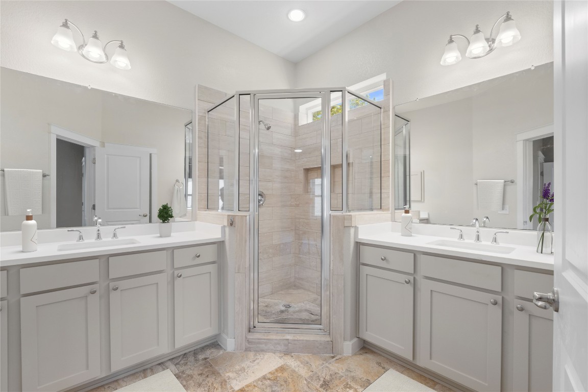 3900 Threadgill Street, Unit 16 Austin, TX 78723 - Photo 7 of 40 a bathroom with a double vanity sink mirror and double