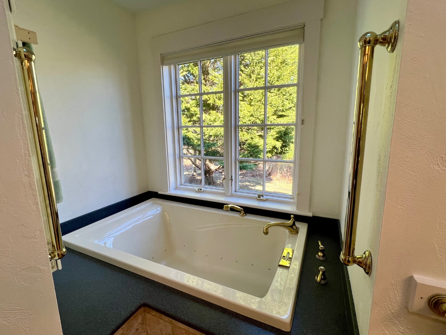 300 N Road Chilmark, MA 02535 - Photo 13 of 39 a bath tub sitting in a bathroom next to a window