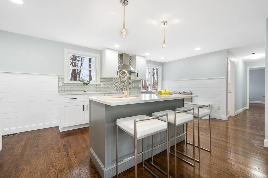 217 Marked Tree Road Holliston, MA 01746 - Photo 11 of 30 a kitchen with a sink cabinets and wooden floor