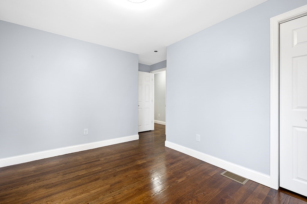 217 Marked Tree Road Holliston, MA 01746 - Photo 12 of 30 a view of an empty room with wooden floor