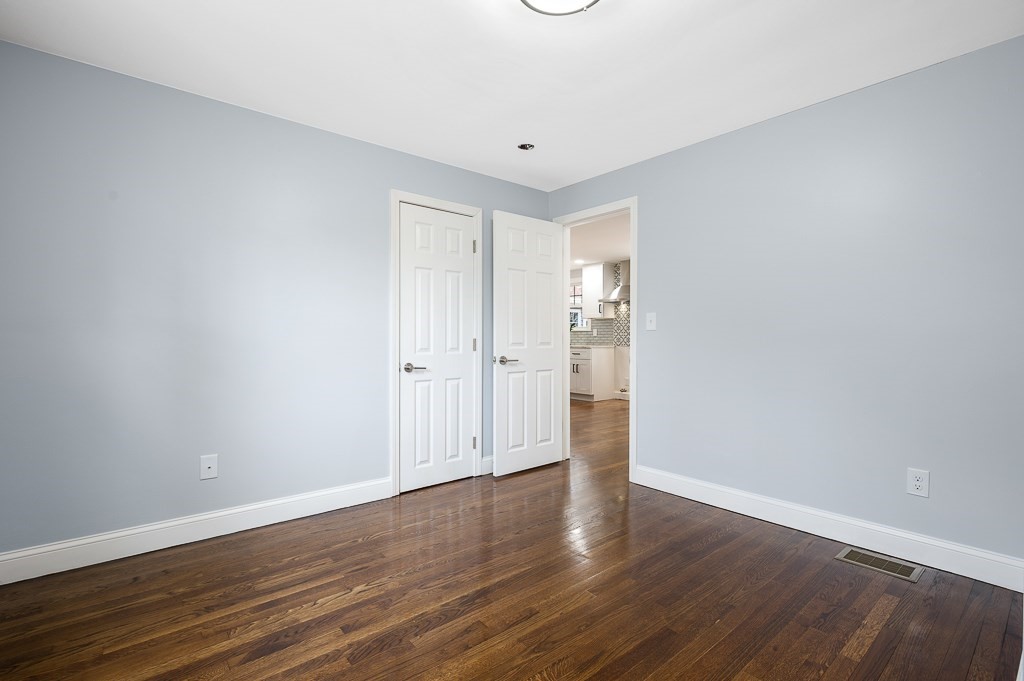 217 Marked Tree Road Holliston, MA 01746 - Photo 15 of 30 a view of an empty room with wooden floor
