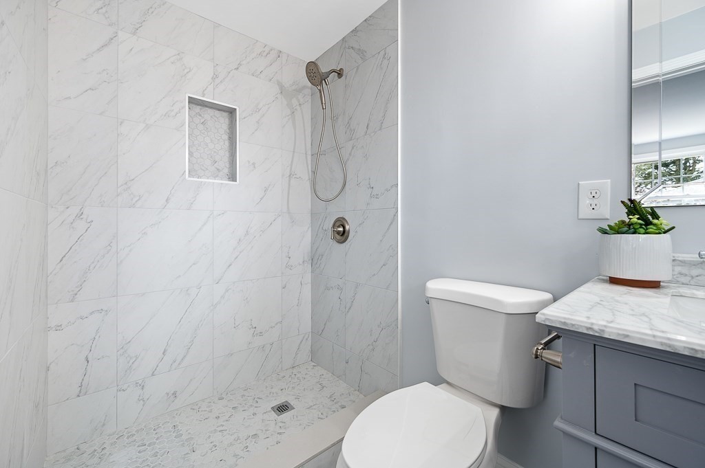 217 Marked Tree Road Holliston, MA 01746 - Photo 20 of 30 a white toilet next to a bathroom