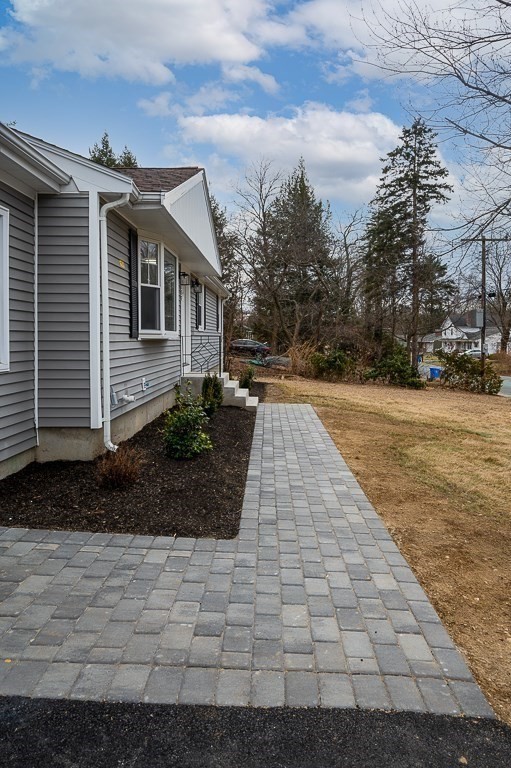 217 Marked Tree Road Holliston, MA 01746 - Photo 3 of 30 a front view of a house with a yard