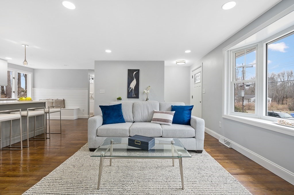 217 Marked Tree Road Holliston, MA 01746 - Photo 5 of 30 a living room with furniture a large window and wooden floor