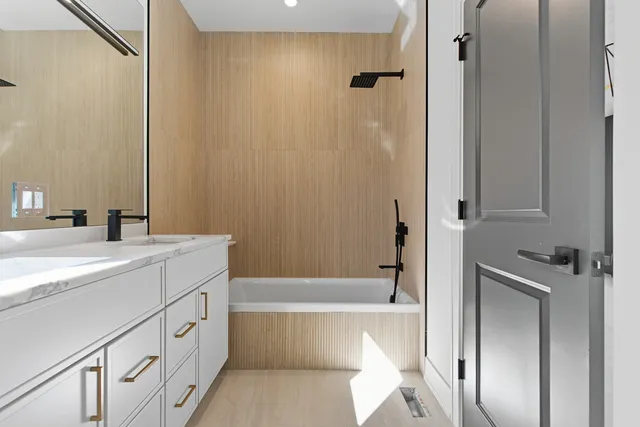 a bathroom with a bathtub and a sink