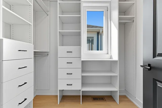 a view of an empty walk in closet