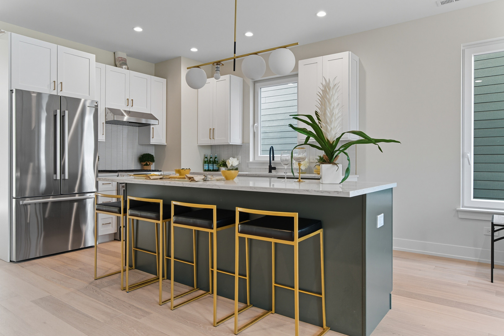 5254 West Newport Avenue Chicago, IL 60641 - Photo 4 of 27 a kitchen with kitchen island stainless steel appliances a sink and counter space
