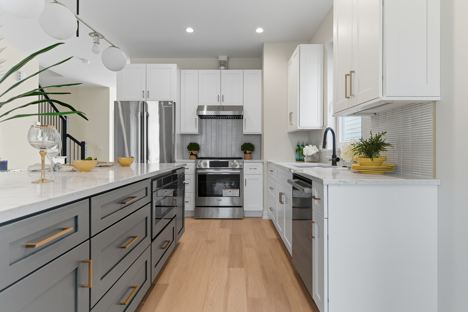 5254 West Newport Avenue Chicago, IL 60641 - Photo 5 of 27 a kitchen with stainless steel appliances granite countertop a lot of counter space and cabinets