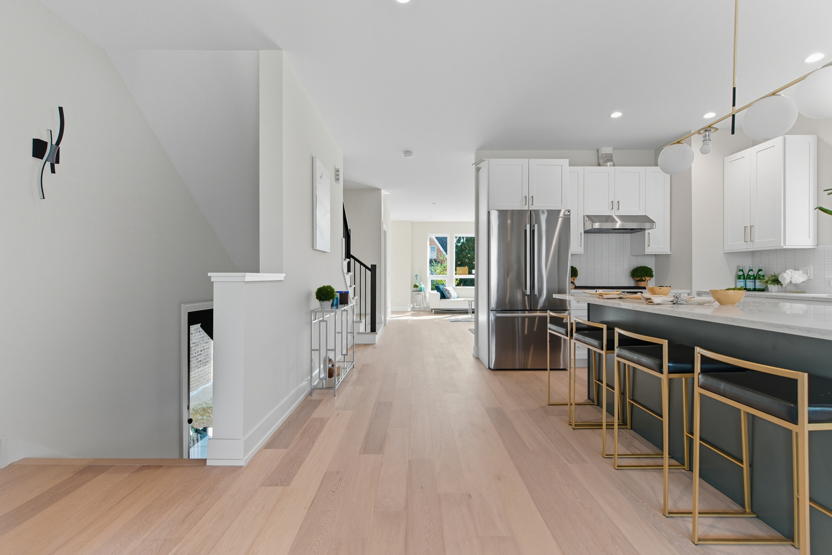 5254 West Newport Avenue Chicago, IL 60641 - Photo 7 of 27 a kitchen with stainless steel appliances a refrigerator and a stove top oven
