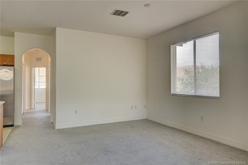 63 Southeast Palermo, Unit 202 Stuart, FL 34994 - Photo 17 of 30 an empty room with windows and closet