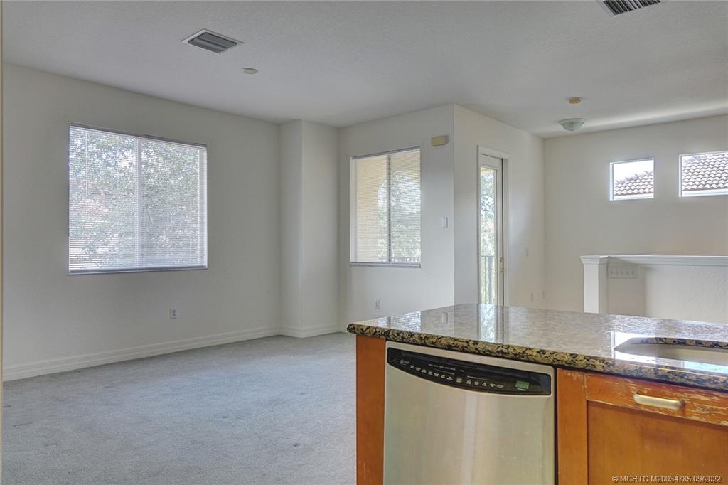 63 Southeast Palermo, Unit 202 Stuart, FL 34994 - Photo 22 of 30 a view of a kitchen cabinets and a stove
