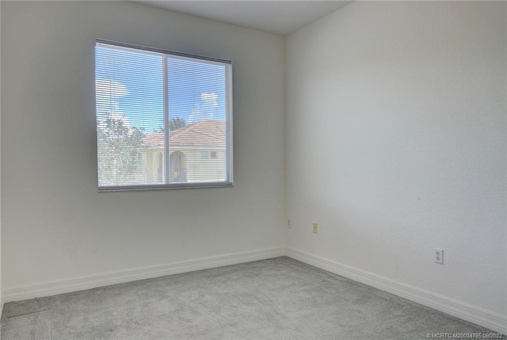63 Southeast Palermo, Unit 202 Stuart, FL 34994 - Photo 24 of 30 an empty room with a window