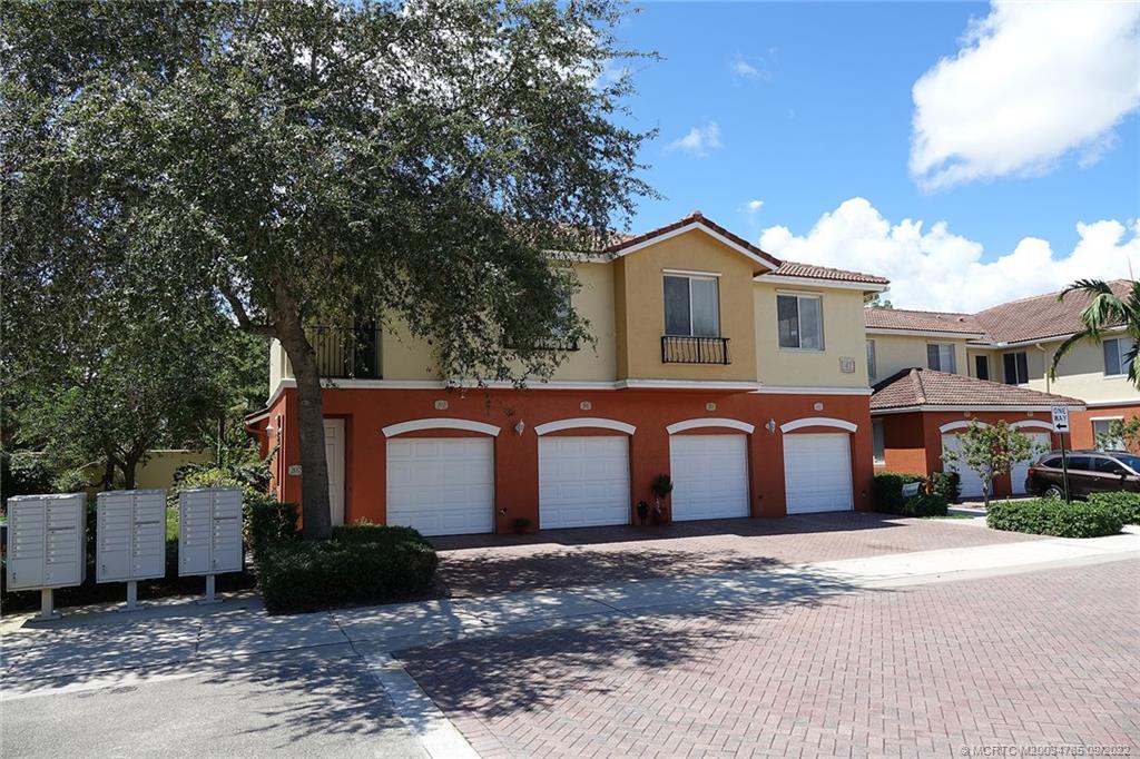 63 Southeast Palermo, Unit 202 Stuart, FL 34994 - Photo 6 of 30 a house view with a outdoor space