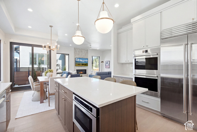 4092 Discovery Way Park City, UT 84098 - Photo 12 of 66 Gourmet kitchen with stainless steel appliances, double ovens, and a large central island with seating