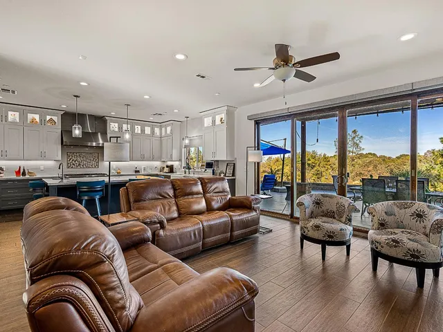 a bedroom with bed and wall painting with wooden floor
