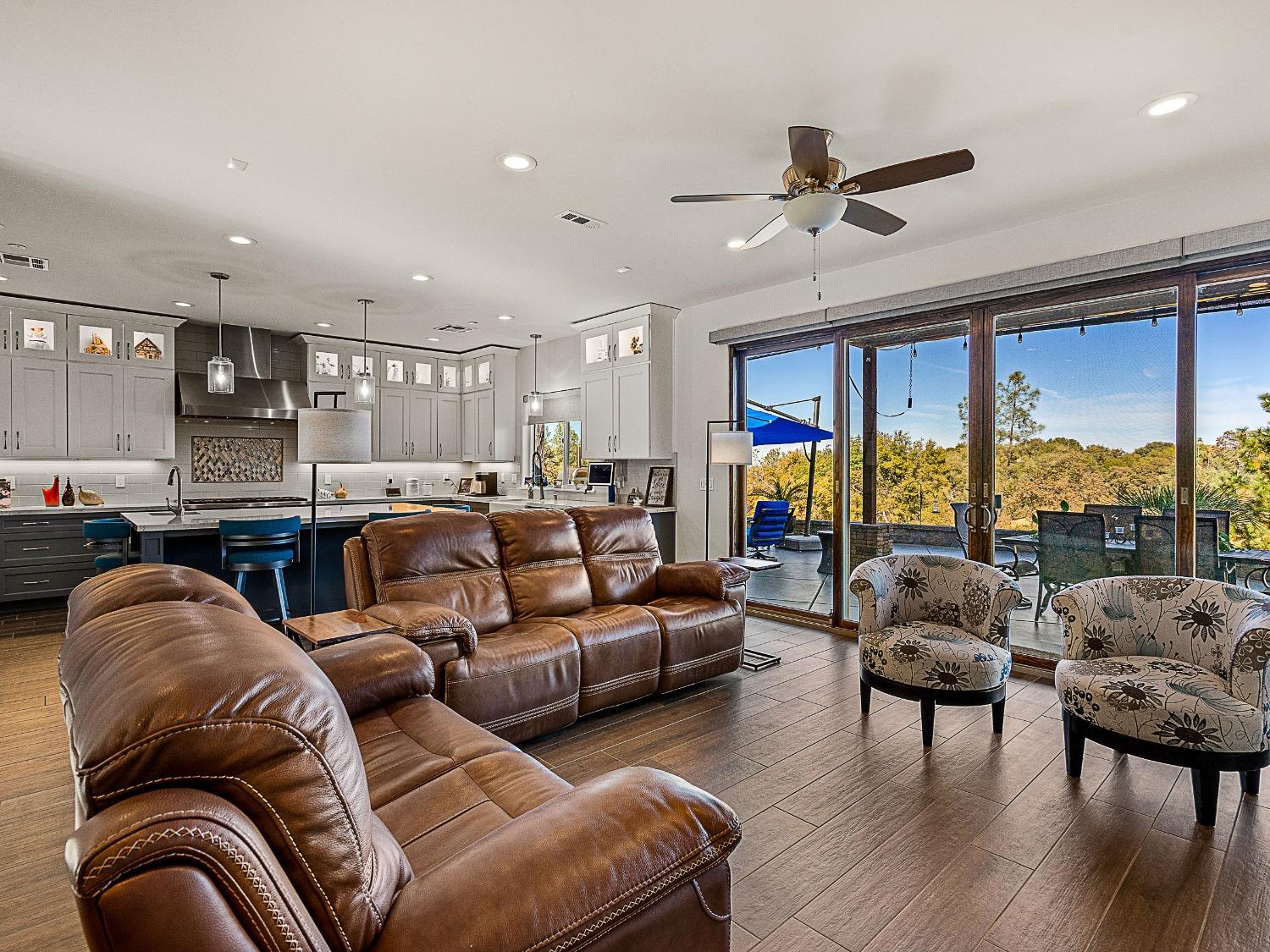 3102 Squirrel Hollow Mount Aukum, CA 95656 - Photo 13 of 51 a living room with furniture and a large window