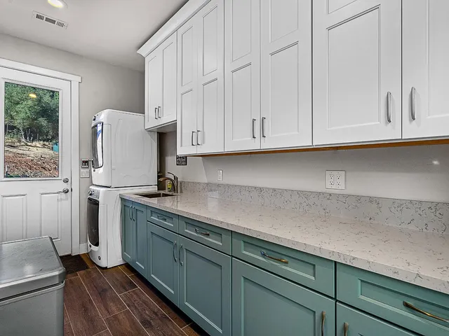 a view of a yard with large trees