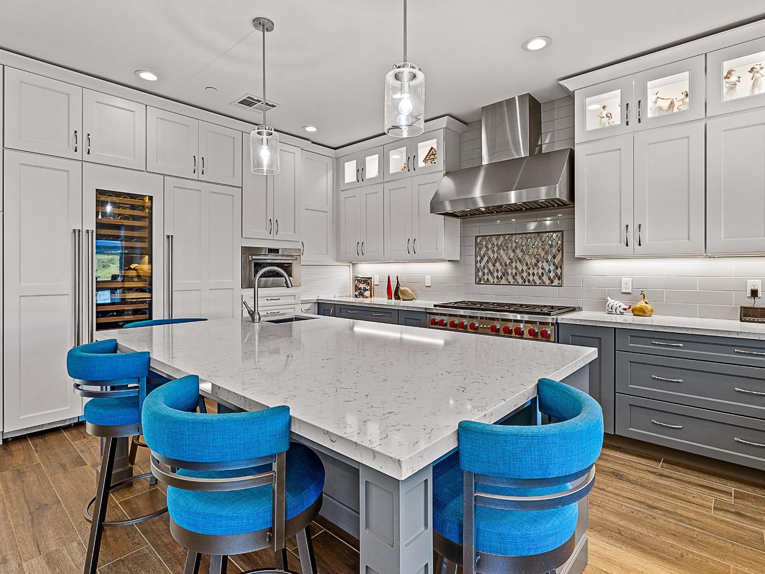 3102 Squirrel Hollow Mount Aukum, CA 95656 - Photo 7 of 51 a kitchen with a table chairs sink and cabinets