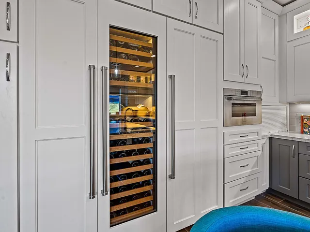 a spacious bedroom with a bed and a large window