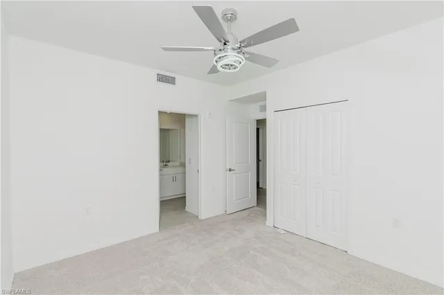 a view of a livingroom with a ceiling fan