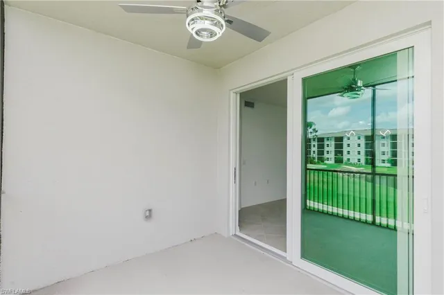 a view of a room that has a large window