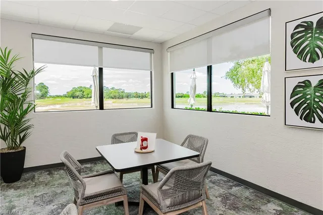 a view of a dining room with furniture window and outside view