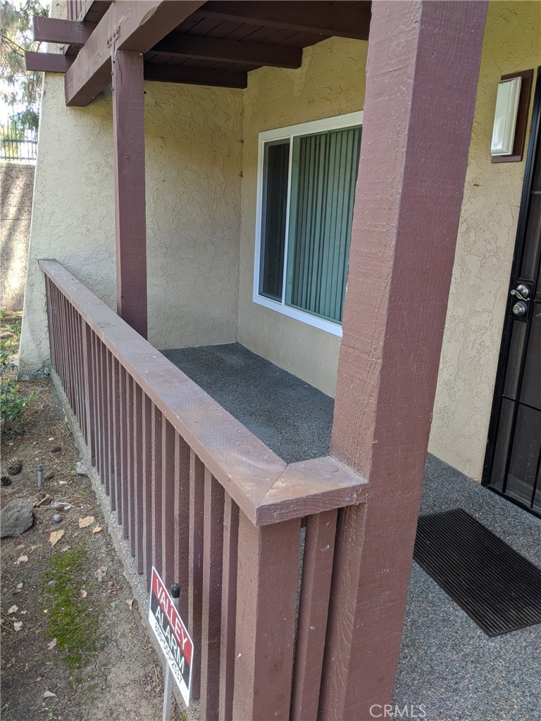 1010 West MacArthur Boulevard, Unit 147 Santa Ana, CA 92707 - Photo 11 of 12 a view of a balcony with wooden floor
