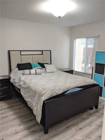 a bedroom with a bed and window