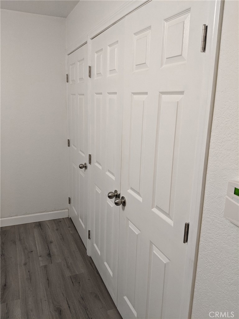 1010 West MacArthur Boulevard, Unit 147 Santa Ana, CA 92707 - Photo 9 of 12 a view of a room with wooden floor