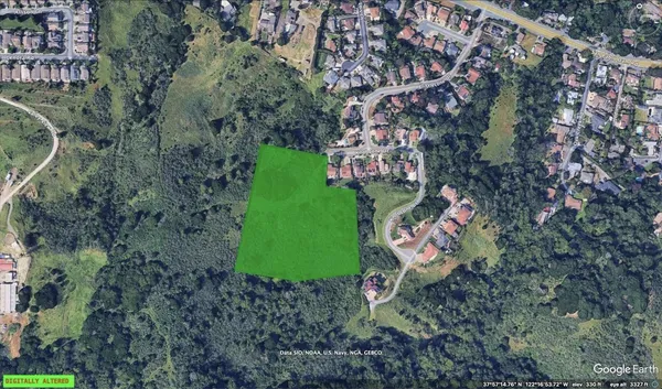 an aerial view of a red and white house