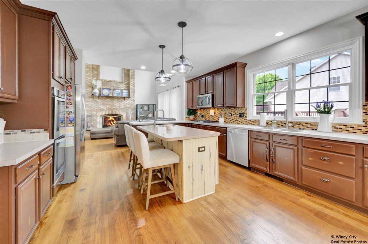 1880 Crofton Drive Algonquin, IL 60102 - Photo 11 of 44 a kitchen with a sink a counter space appliances and a window