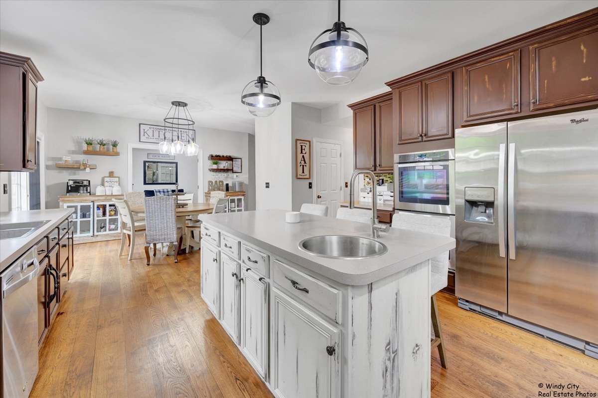 1880 Crofton Drive Algonquin, IL 60102 - Photo 12 of 44 a kitchen with stainless steel appliances a sink stove and refrigerator
