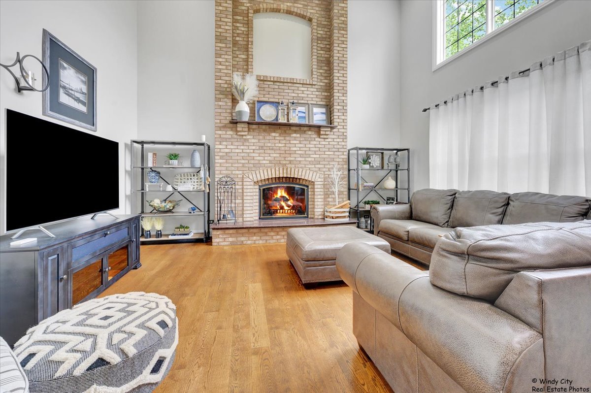 1880 Crofton Drive Algonquin, IL 60102 - Photo 15 of 44 a living room with furniture and a flat screen tv