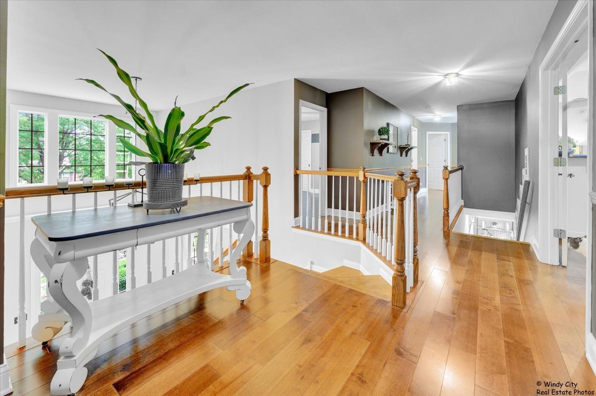 1880 Crofton Drive Algonquin, IL 60102 - Photo 18 of 44 a view of a porch with wooden floor and windows