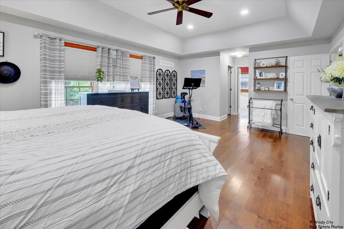 1880 Crofton Drive Algonquin, IL 60102 - Photo 20 of 44 a bed room with a bed and a chandelier