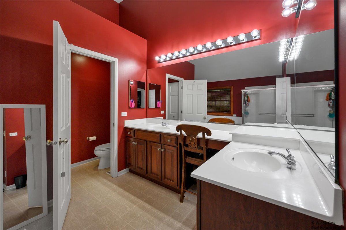 1880 Crofton Drive Algonquin, IL 60102 - Photo 21 of 44 a bathroom with a sink double vanity and a shower