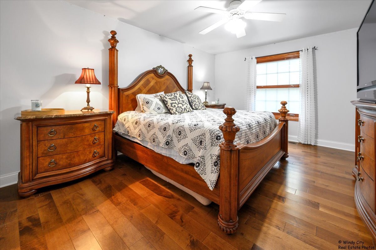 1880 Crofton Drive Algonquin, IL 60102 - Photo 24 of 44 a bed sitting in a bedroom next to a window