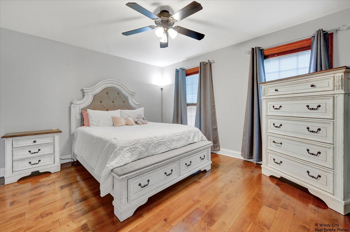 1880 Crofton Drive Algonquin, IL 60102 - Photo 28 of 44 a bedroom with a bed and a dresser