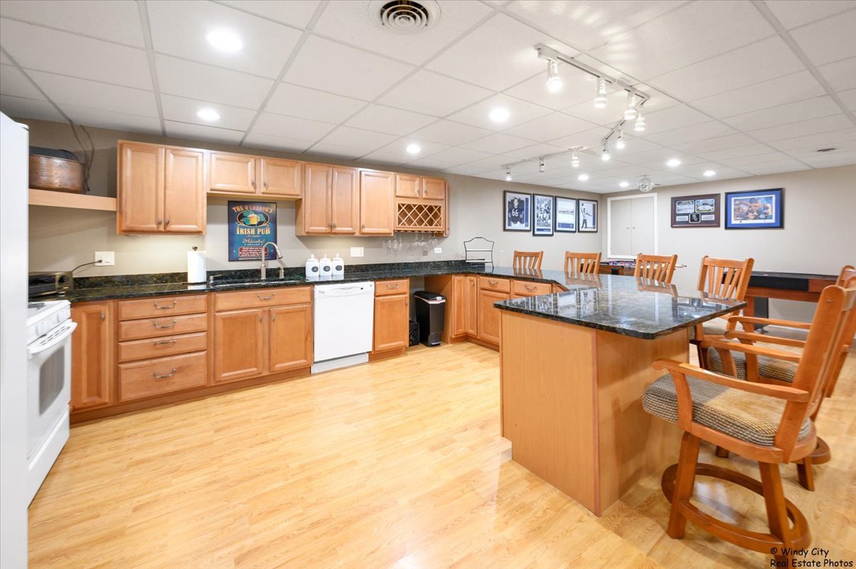 1880 Crofton Drive Algonquin, IL 60102 - Photo 30 of 44 a large kitchen with cabinets table and chairs