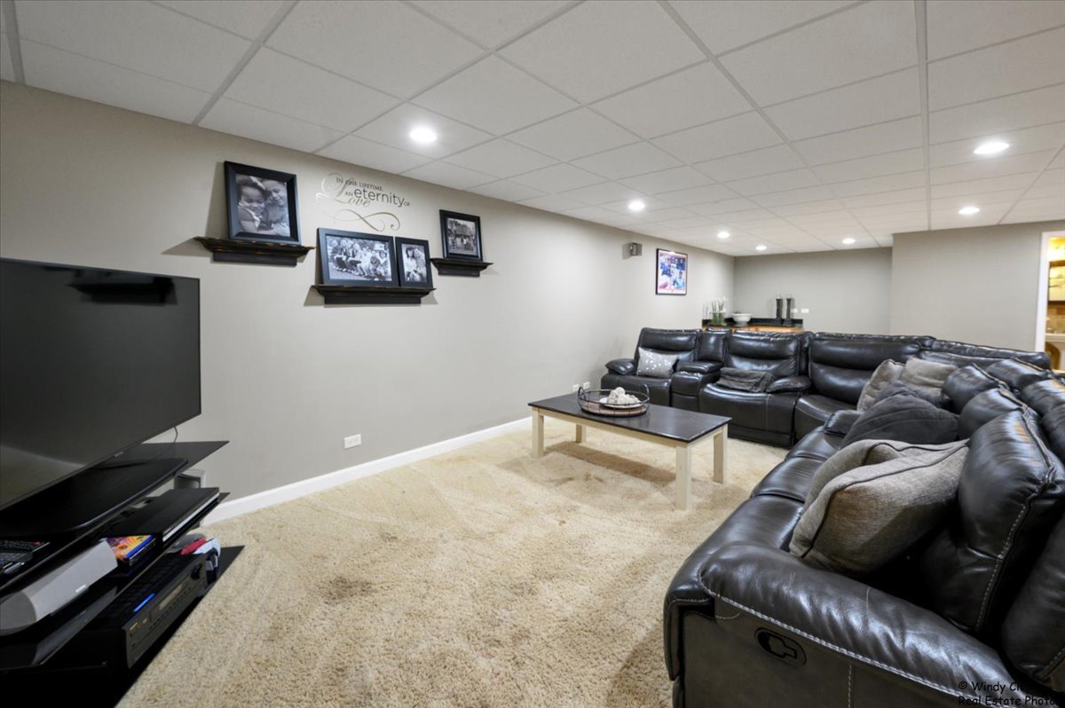 1880 Crofton Drive Algonquin, IL 60102 - Photo 34 of 44 a living room with furniture and a flat screen tv