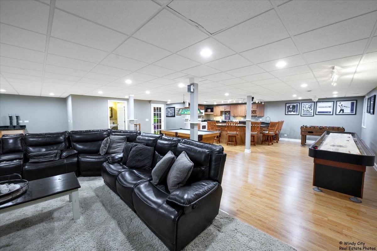 1880 Crofton Drive Algonquin, IL 60102 - Photo 38 of 44 a living room with lots of furniture and kitchen view
