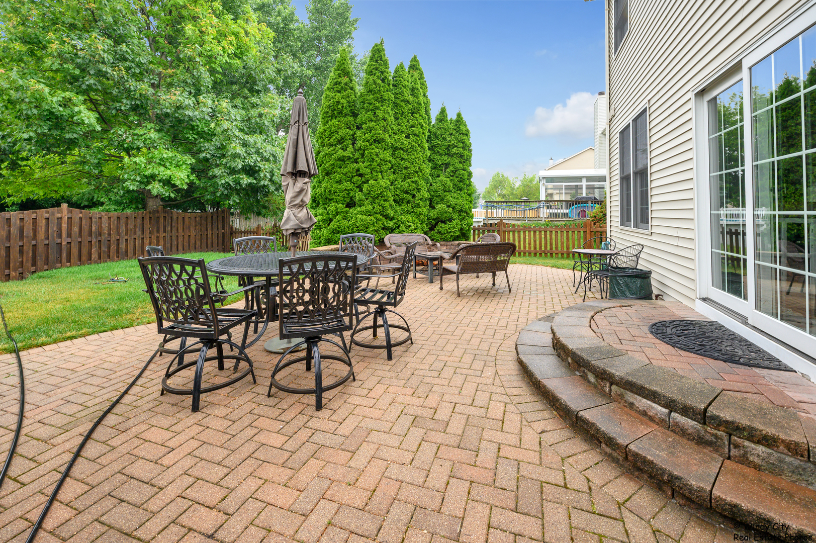 1880 Crofton Drive Algonquin, IL 60102 - Photo 39 of 44 a view of a patio with a dining table and chairs with wooden floor and fence