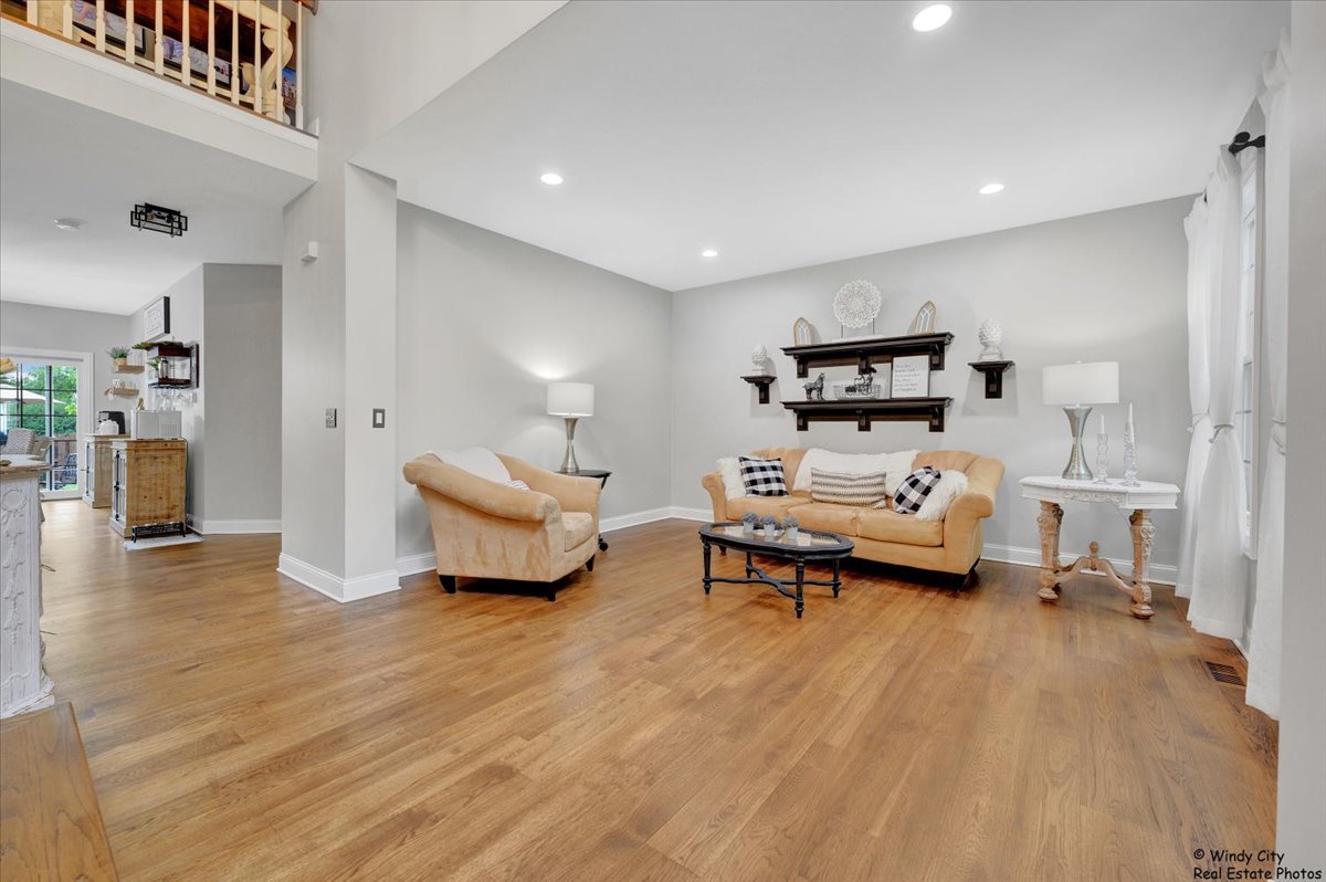 1880 Crofton Drive Algonquin, IL 60102 - Photo 6 of 44 a bedroom with furniture and a wooden floor