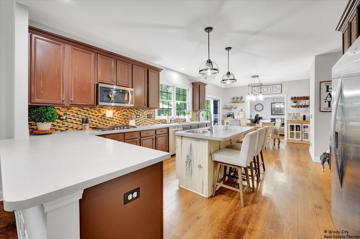 1880 Crofton Drive Algonquin, IL 60102 - Photo 10 of 44 a kitchen with a table chairs stove and cabinets