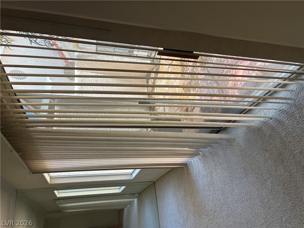 5272 Island Chain Road Las Vegas, NV 89118 - Photo 34 of 39 Sun-filled interior space with skylights and wall-to-wall carpeting for comfort.
