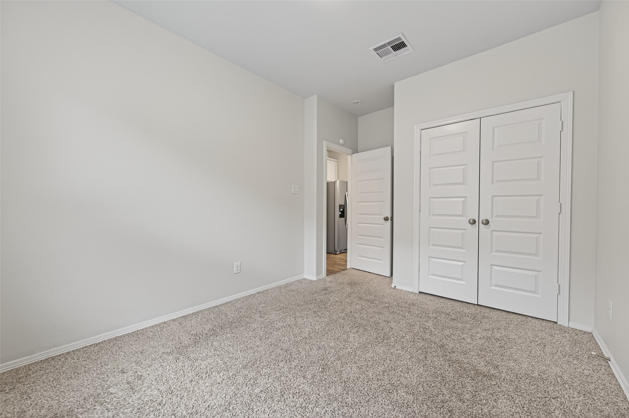 23222 Spring Genesis Lane Katy, TX 77493 - Photo 23 of 43 Bright, inviting bedroom room with ample natural light and a convenient built-in closet.