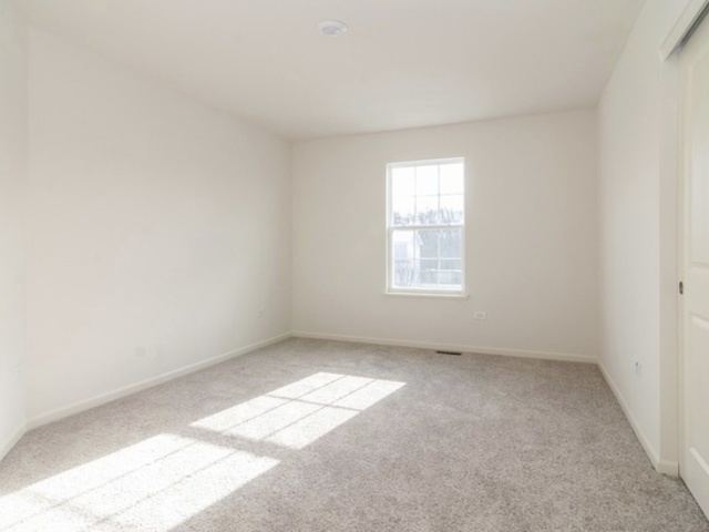 3118 Patterson Road Montgomery, IL 60538 - Photo 13 of 23 an empty room with a window